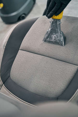 Closeup vacuum and dry cleaning fabric of seat. Car interior detailingの写真素材