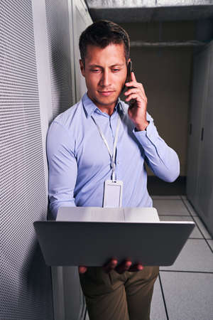 System administrator calling on cellphone in server room