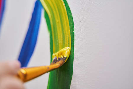 Close up of artist drawing bright linesの写真素材