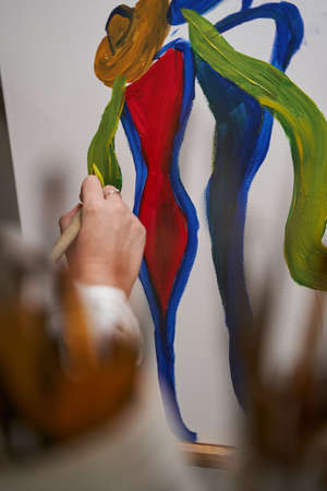 Close up of artist painting on canvasの写真素材