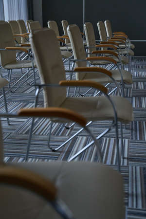 Line of chairs staying in airport loungeの写真素材