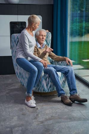 Relaxed mature people spending weekend at homeの写真素材