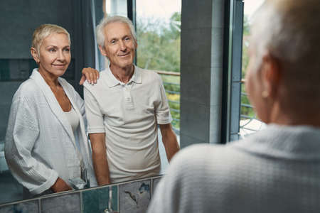 Two happy people spending morning in bathroomの写真素材