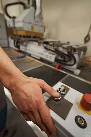 Close up of male hand pressing the button