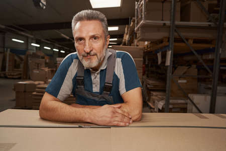 Portrait of handsome craftsman looking at camera