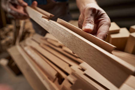 Focused photo on wooden bar being in hand