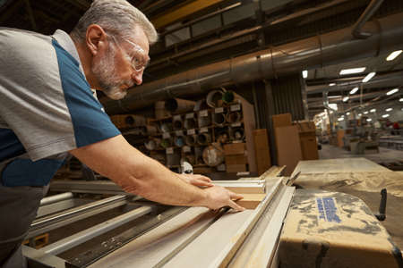 Portrait of serious craftsman laboring in his workshop