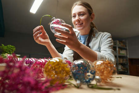 Smiling pretty woman working in the studioの写真素材