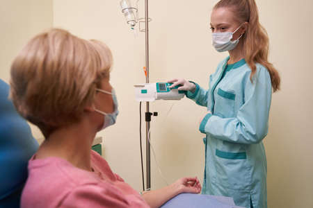 Profile photo of nurse talking to the patientの写真素材