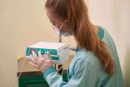 Close up of nurse preparing dropper for patient