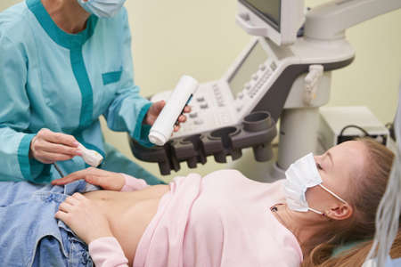 Close up of young woman visiting her doctorの写真素材