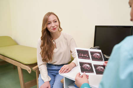 Emotional female person looking at her practitioner