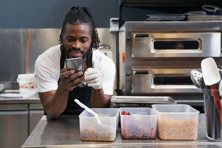Chef resting after work in the kitchenの写真素材