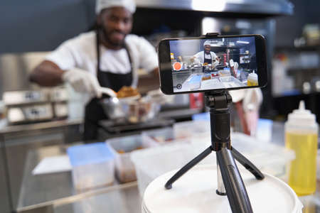 American chef shooting online video cooking lessonの写真素材