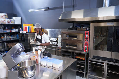 Chef ending the work at the kitchen