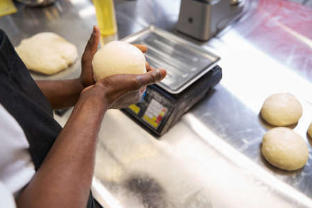Man preparing ingredients for baking at the kitchen