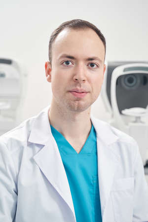 Male ophthalmologist in his office in the hospitalの写真素材