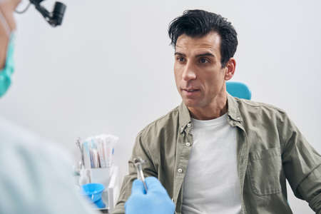 Portrait of patient at the appointment of otorhinolaryngologistの写真素材