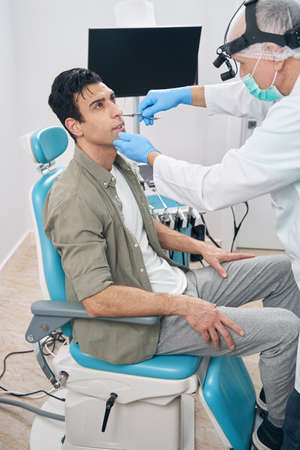 Male at otorhinolaryngologist appointment in the hospitalの写真素材