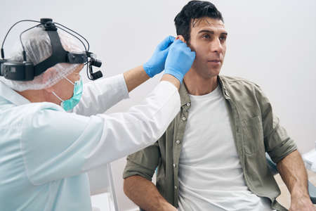 Close-up photo of man in the doctor officeの写真素材