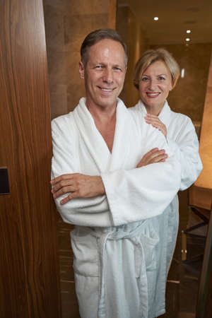 Cute middle-aged couple enjoying their relaxing hotel stayの写真素材