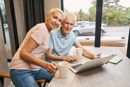 Positive delighted people looking straight at cameraの写真素材