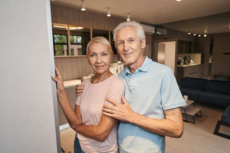 Happy loving aged people taking family photo