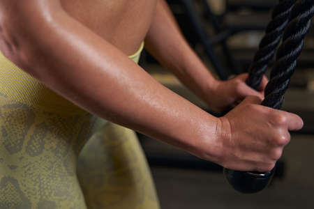 Close up of sportswoman using sport equipment