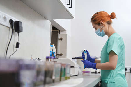 Close-up photo of medical stuff and lady in the laboratory