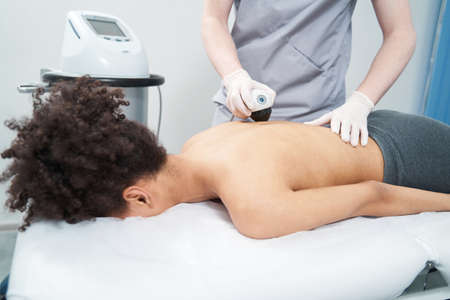 Adult woman on massage session in the salon
