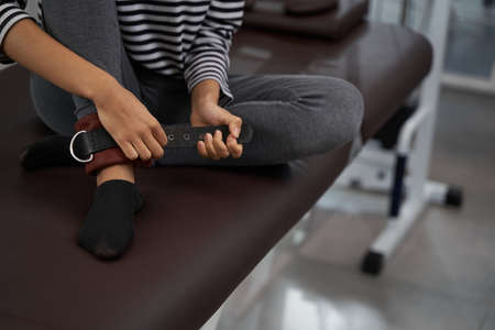 Lady in the gym getting ready for exercise