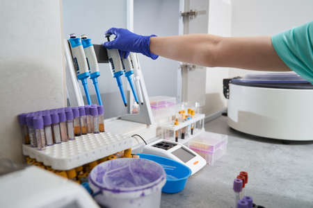 Woman in medical suit working in laboratory