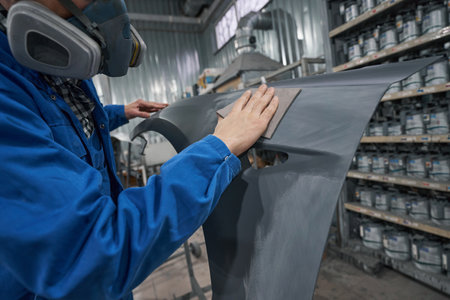 Portrait of male in respirator hard working in workshopの写真素材