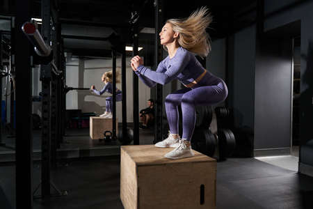 Sporty beautiful female standing in the fitnessの写真素材