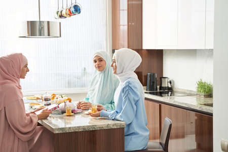 Friendly atmosphere at home after morning prayerの写真素材