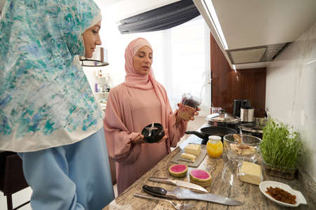 Friendly Muslim women sharing their traditional recipesの写真素材