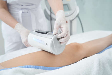 Person conducting endospheres therapy on patient leg