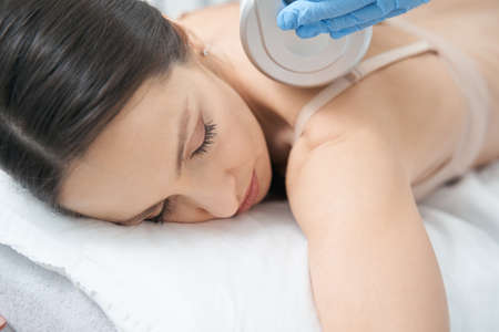 Neck massage of woman performed with endosphere roller