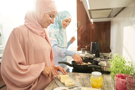 Muslim women preparing food for dinner in kitchenの写真素材