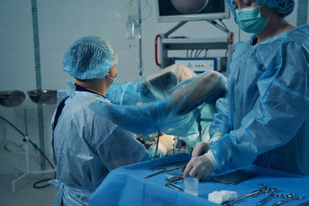 Woman with covered legs undergoing hysteroscopy in clinicの写真素材
