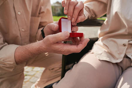 Close up of male hand that holding gift box