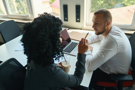 Managers, tired man and woman with coffee, communicate at workplace
