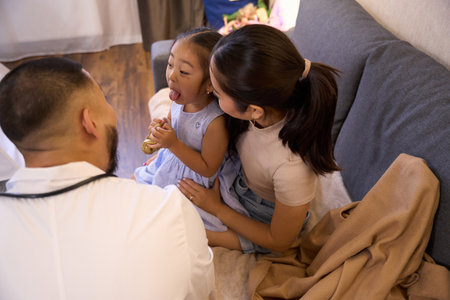 Little asian girl at the appointment with an otolaryngologistの写真素材