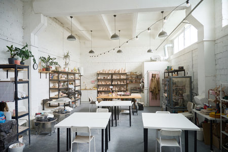 Modern pottery workshop with shelving and tablesの写真素材