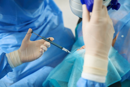 Close up photo of doctor holding surgical instrument