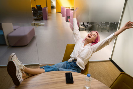 Woman sitting in rest room during break between work