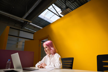 Pretty lady working online during quarantine in coworking