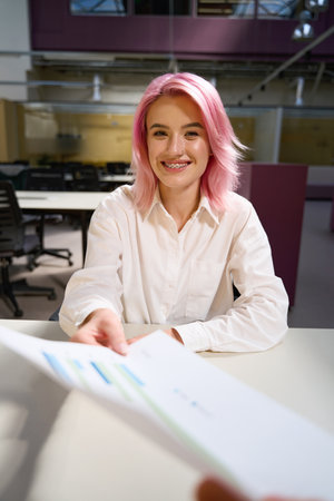 Business lady working in the office and making contractsの写真素材