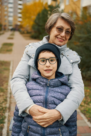 Kid and grandmother having fun, spending time togetherの写真素材
