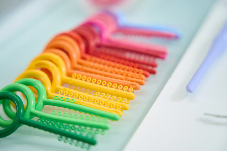 Close up of rainbow set of consumables for orthodontics